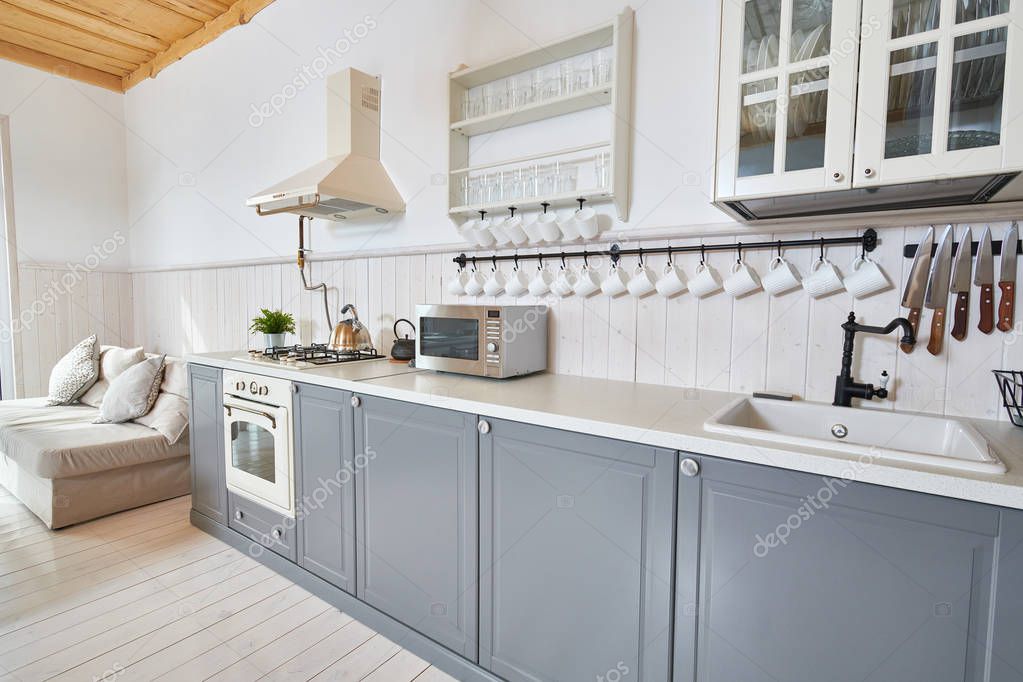 Kitchen cabinets after smooth white paint and new hardware