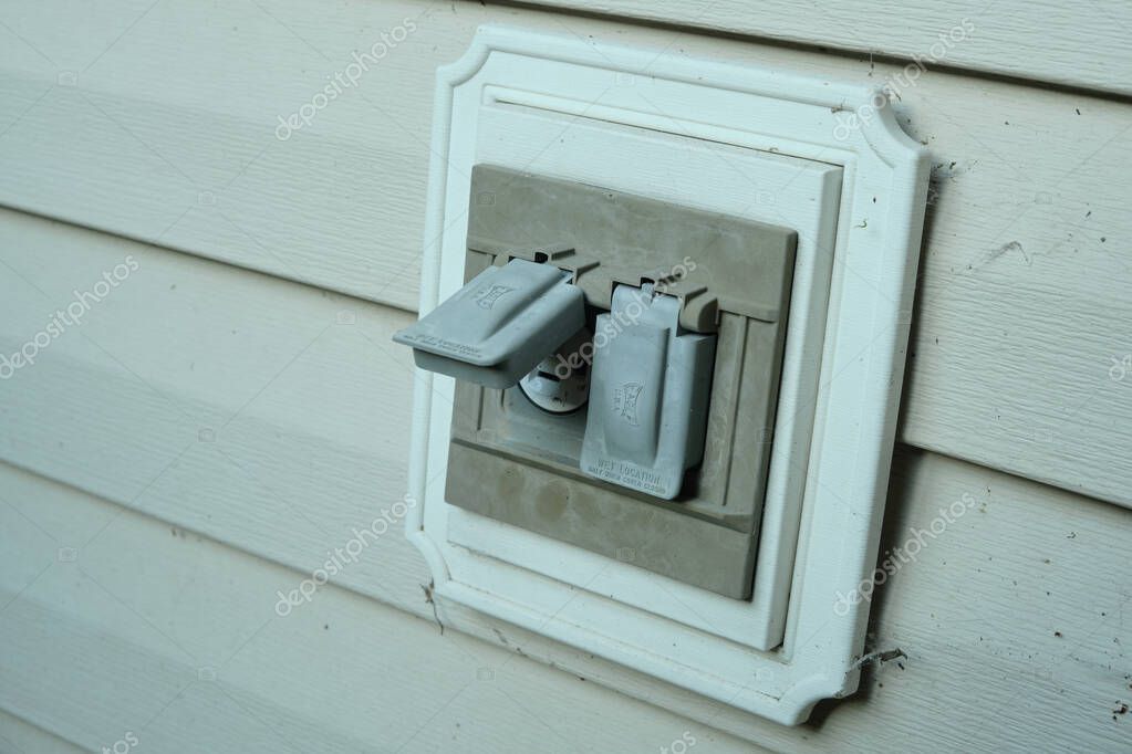 Repaired outlet secured with new cover plate and tidy wall