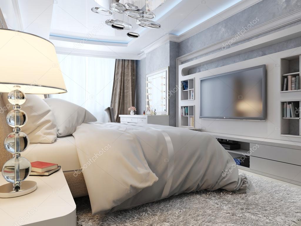 Bedroom TV with cords routed neatly through wall for clean look