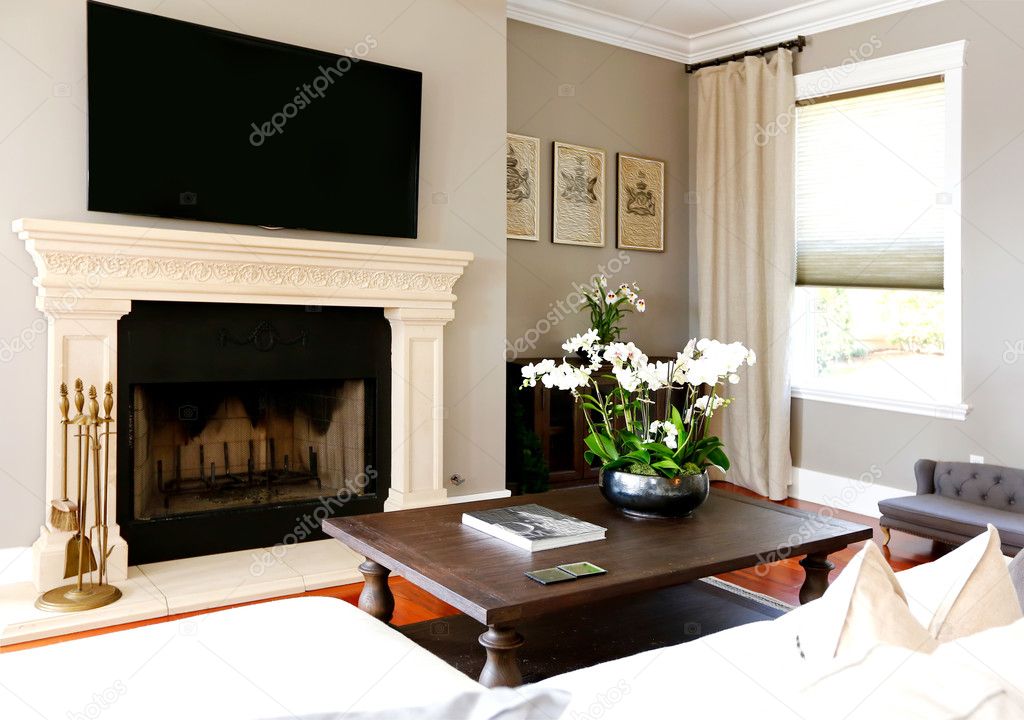TV securely mounted above fireplace with level alignment